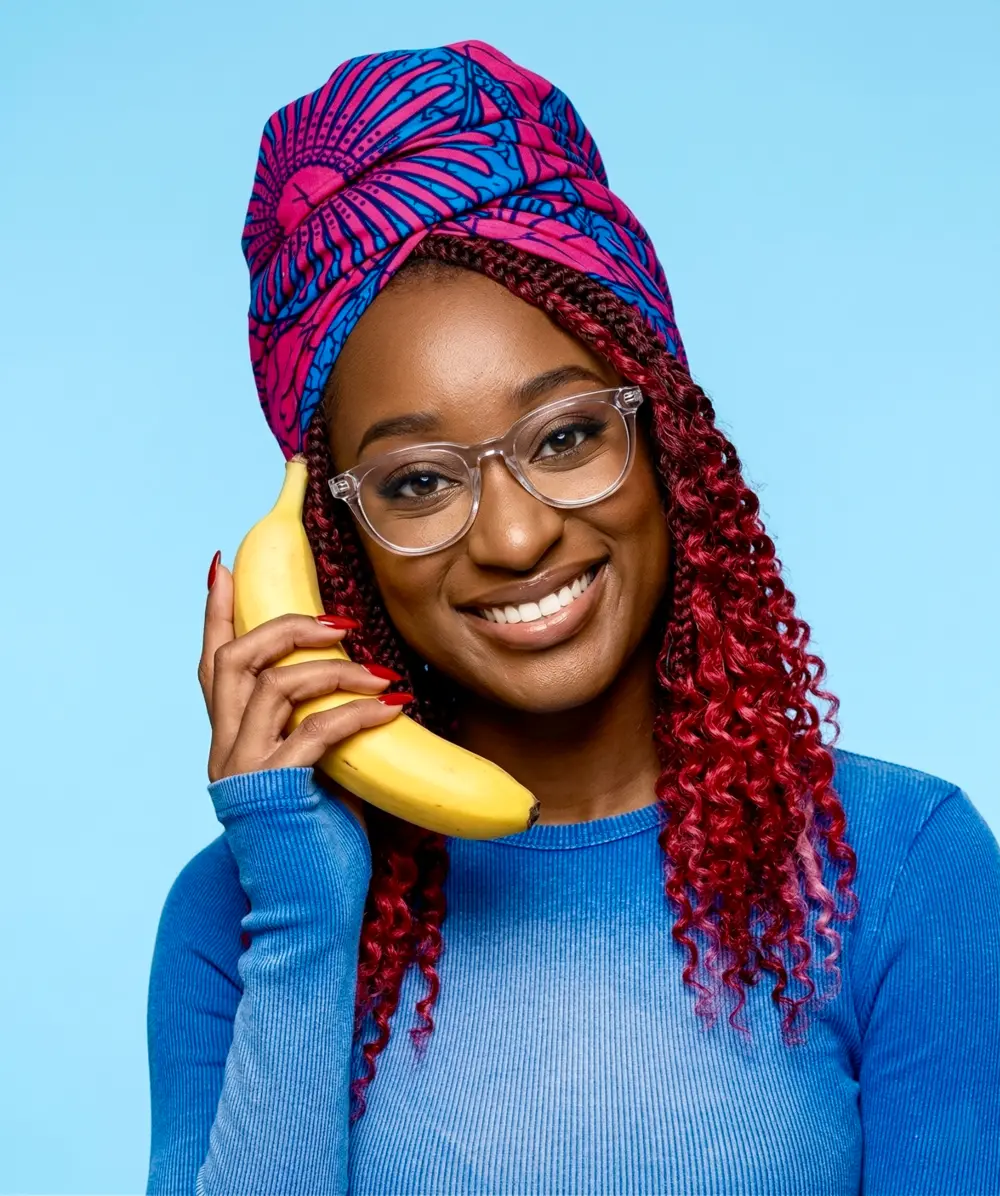 Shiloh playfully holding a banana like a phone